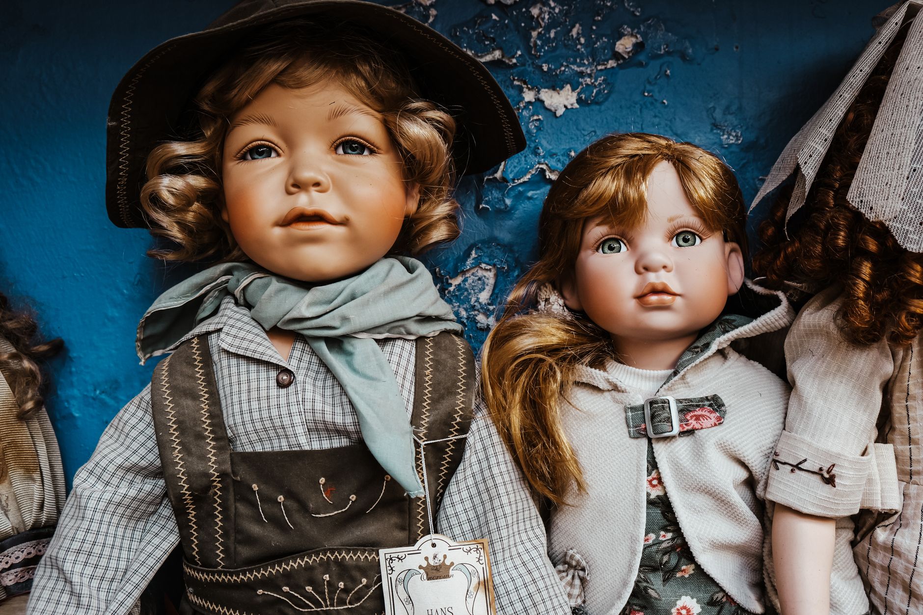 Antique porcelain doll in a dark Edinburgh attic, evoking horror novels cursed objects UK readers will recognise